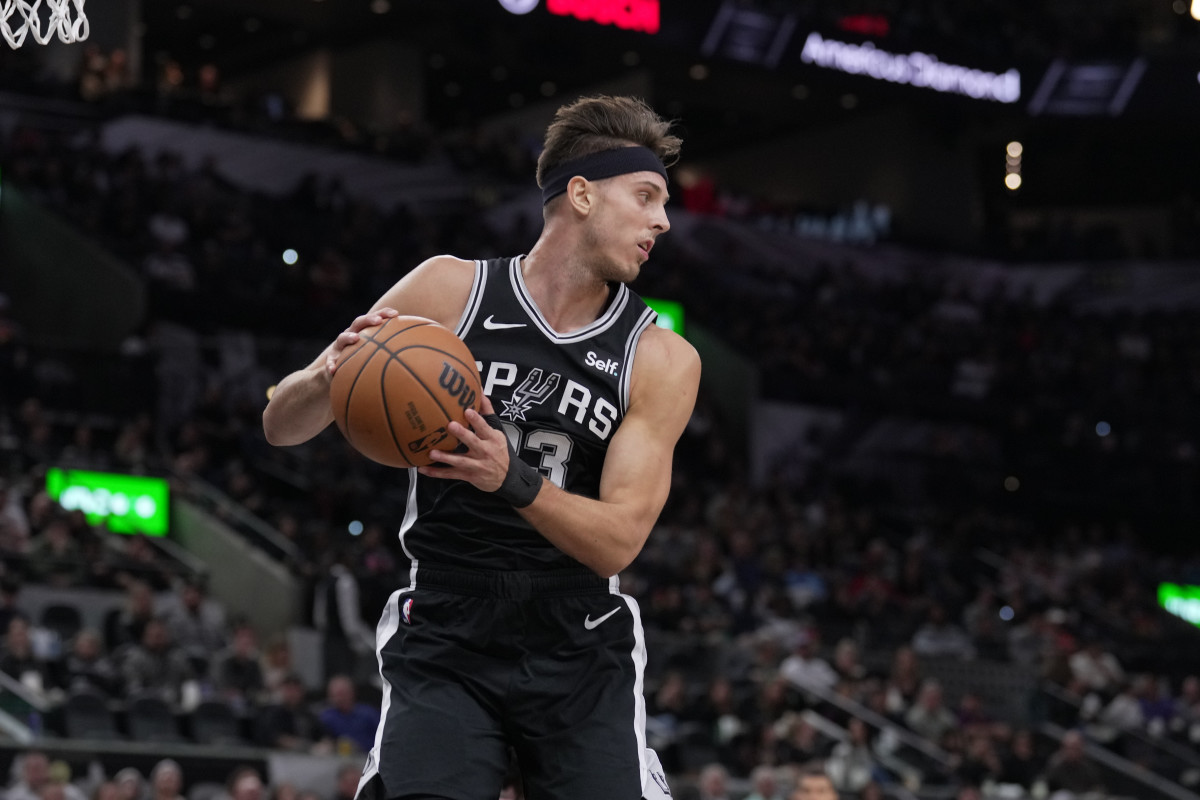 Dec 8, 2023; San Antonio, Texas, USA; San Antonio Spurs forward Zach Collins (23) brings down a rebound in the first half against the Chicago Bulls at the Frost Bank Center.